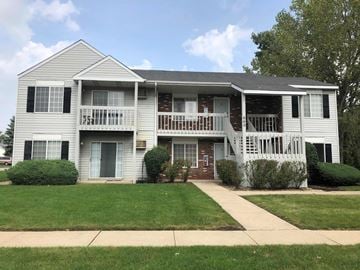 Grayslake apartment for rent - a white house with a porch and a lawn