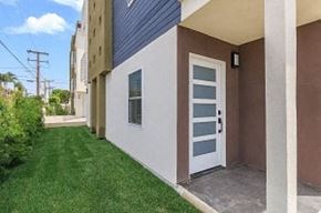 Hawthorne apartment for rent - the front of a house with a white door and a lawn