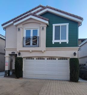 Hawthorne apartment for rent - a white and green house with a garage door