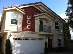 Hawthorne apartment for rent - a red and white house with a garage door