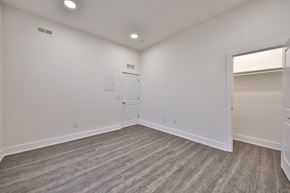 Philadelphia apartment for rent - an empty living room with white walls and a door to a closet