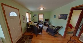 Sitka house for rent - a living room with a table and chairs