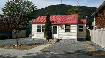 Sitka house for rent - a small white house with a red roof