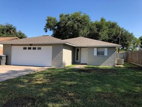 Bay City house for rent - A house with a brown roof and a white garage door.