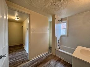 Dravosburg apartment for rent - A bathroom with a white sink and a window.