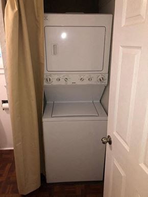 Morrow apartment for rent - A white washing machine sits in a small laundry room.