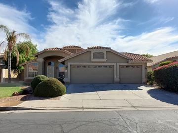 Chandler house for rent - A house with a brown roof and a garage door.