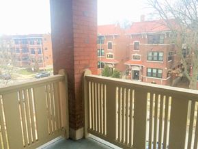 Saint Loui apartment for rent - a balcony with a view of a building and a balcony railing