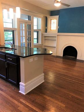 Saint Louis apartment for rent - a kitchen with an island and a fireplace