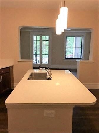 Saint Louis apartment for rent - A kitchen island with a sink and a window above it.