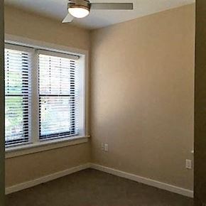 Saint Louis apartment for rent - A room with a window and a ceiling fan.