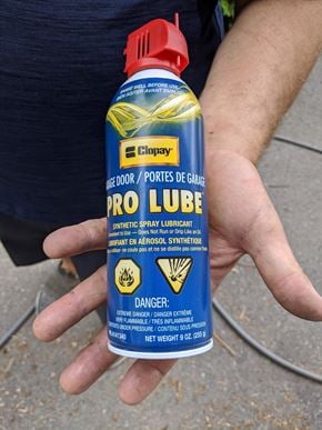 Ottawa house for rent - A hand holding a blue can of Pro Lube.