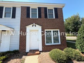 Wilson apartment for rent - A brick house with a white door and windows is labeled "J.W. Hunter Company Inc."
