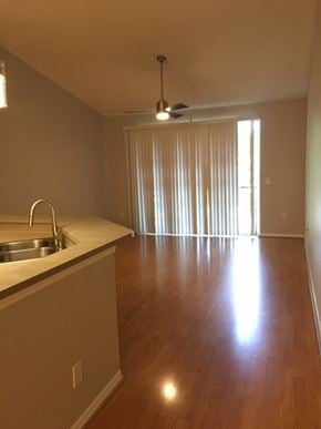 Tampa house for rent - an empty living room and a kitchen with a sink