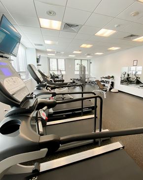 New Haven apartment for rent - a gym with various pieces of exercise equipment