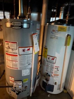 Buffalo apartment for rent - Two large metal tanks with stickers and labels on them.