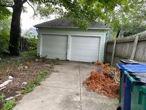 Buffalo apartment for rent - A white garage door is closed and the garage is white.