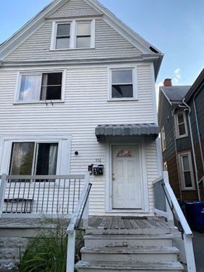 Buffalo apartment for rent - a white house with a white door and stairs