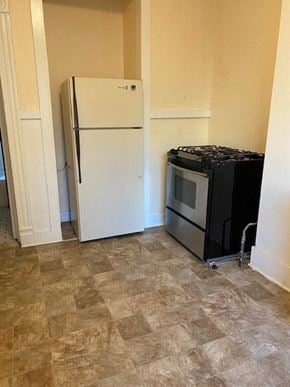 Buffalo apartment for rent - a kitchen with a refrigerator and a stove