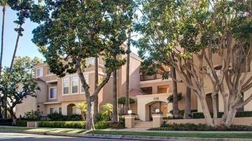 Pasadena apartment for rent - A large house with a tree in front of it.