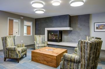 St. Paul apartment for rent - a living room with a fireplace and a coffee table
