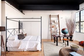Brooklyn apartment for rent - a bedroom with a bed and a ladder in a loft
