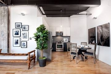 Brooklyn apartment for rent - a living room with a table and a kitchen
