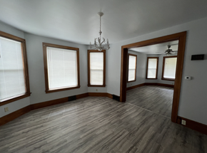 Fremont apartment for rent - an empty living room with wood floors and windows