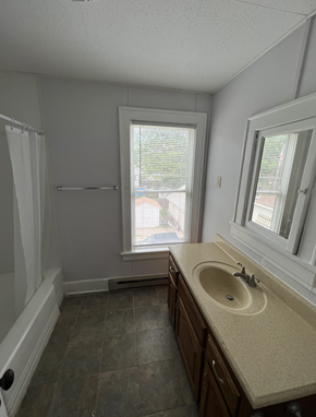 Fremont apartment for rent - an empty bathroom with a sink and a window