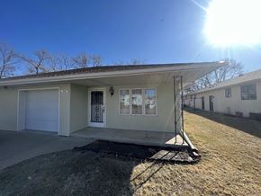 Fremont apartment for rent - A house with a garage and a driveway in front of it.
