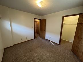 Fremont apartment for rent - A room with a carpeted floor and a doorway leading to another room.