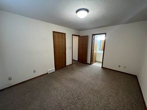 Fremont apartment for rent - A room with carpeted floor and two doors.