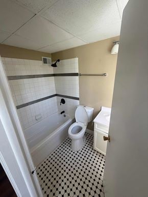 Fremont apartment for rent - A white toilet in a bathroom with a black and white floor.