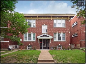 St. Louis apartment for rent - the front of a brick apartment building with a sidewalk and grass