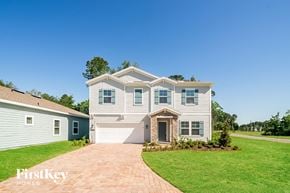 Jacksonville house for rent - a white house with blue shutters and a brick driveway
