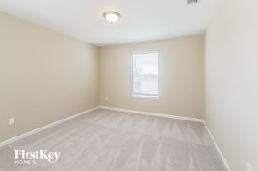 Jacksonville house for rent - a spacious room with white carpet and a window