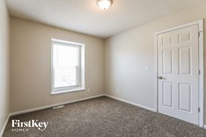 Belton house for rent - a bedroom with a white door and a window