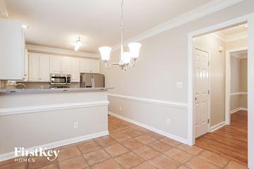 Greensboro house for rent - A kitchen with a counter and cabinets.