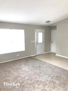 Lake In The Hills house for rent - A room with a carpeted floor and a door.