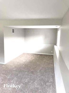 Lake In The Hills house for rent - A room with a carpeted floor and a window.
