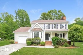 Greensboro house for rent - a white house with a lawn and trees