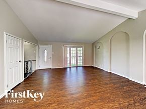 Saint Peters house for rent - an empty living room with wood floors and white walls