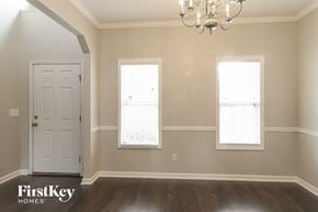 Dallas house for rent - a dining room with a white door and two windows