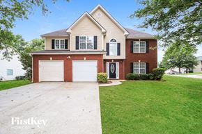 Covington house for rent - A two-story house with a garage is for sale.