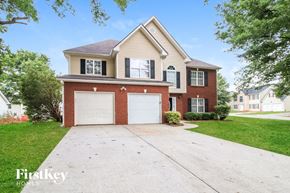 Covington house for rent - A two-story house with a garage is for sale.