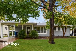 Saint Louis house for rent - a white house with a tree in front of it