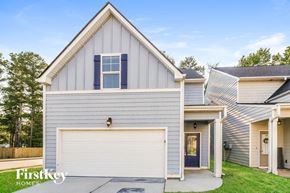 Newnan house for rent - a gray and with a white garage door