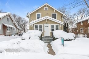 Waukegan house for rent - a house with snow on the ground and a white door