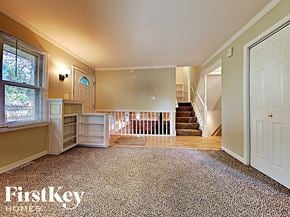 West Chicago house for rent - a fisheye view of a living room with a staircase in the background