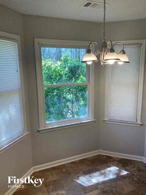 Covington house for rent - A room with a window and a view of trees outside.
